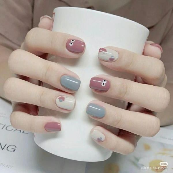 Cute Eyes and Heart Nails Design
